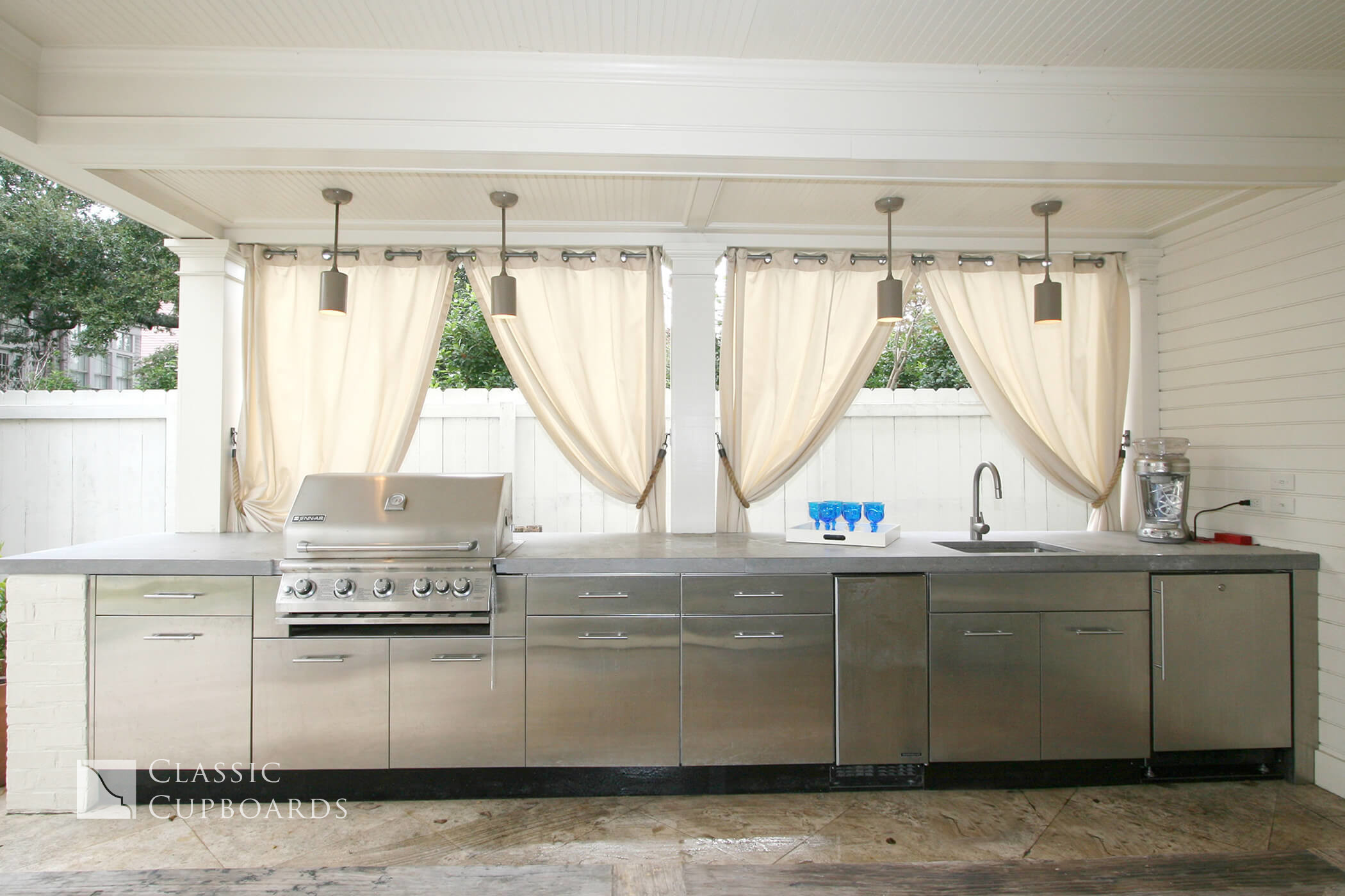custom outdoor kitchen with metal cabinets