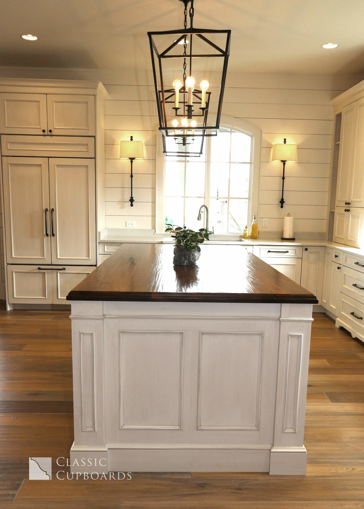 Transitional Kitchen island with wood top