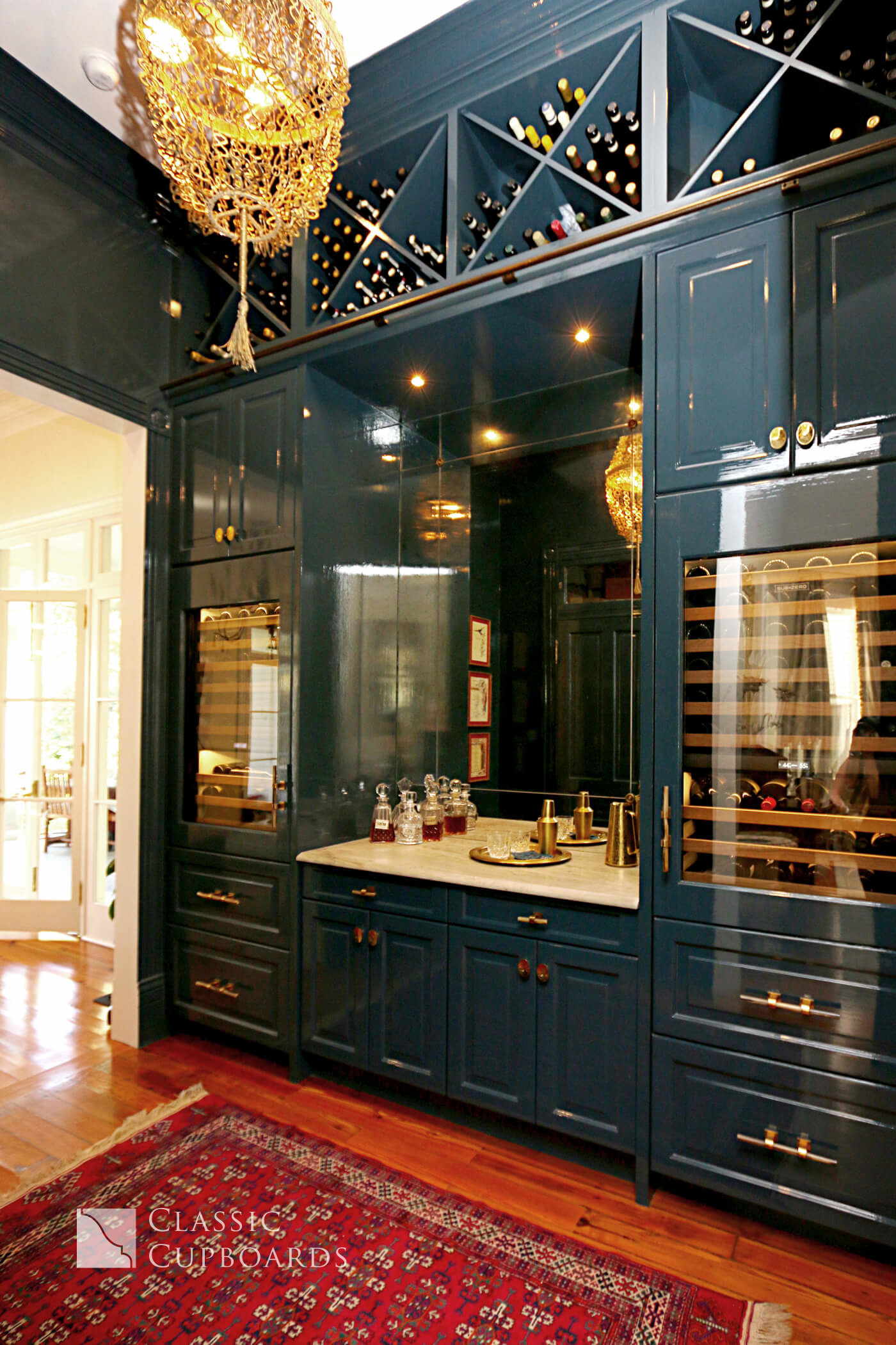 custom home bar with blue cabinetry