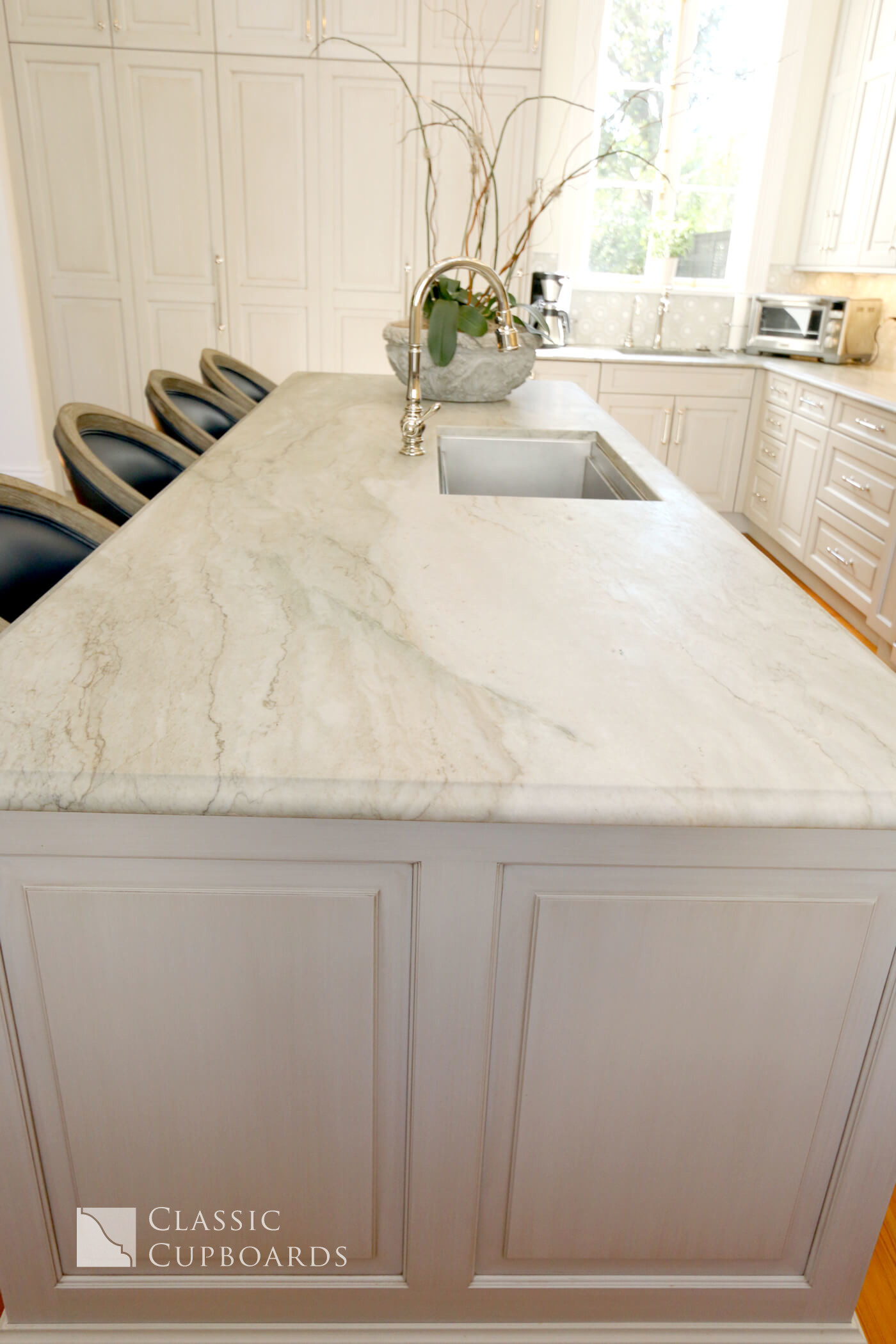 Traditional Kitchen island with marble top