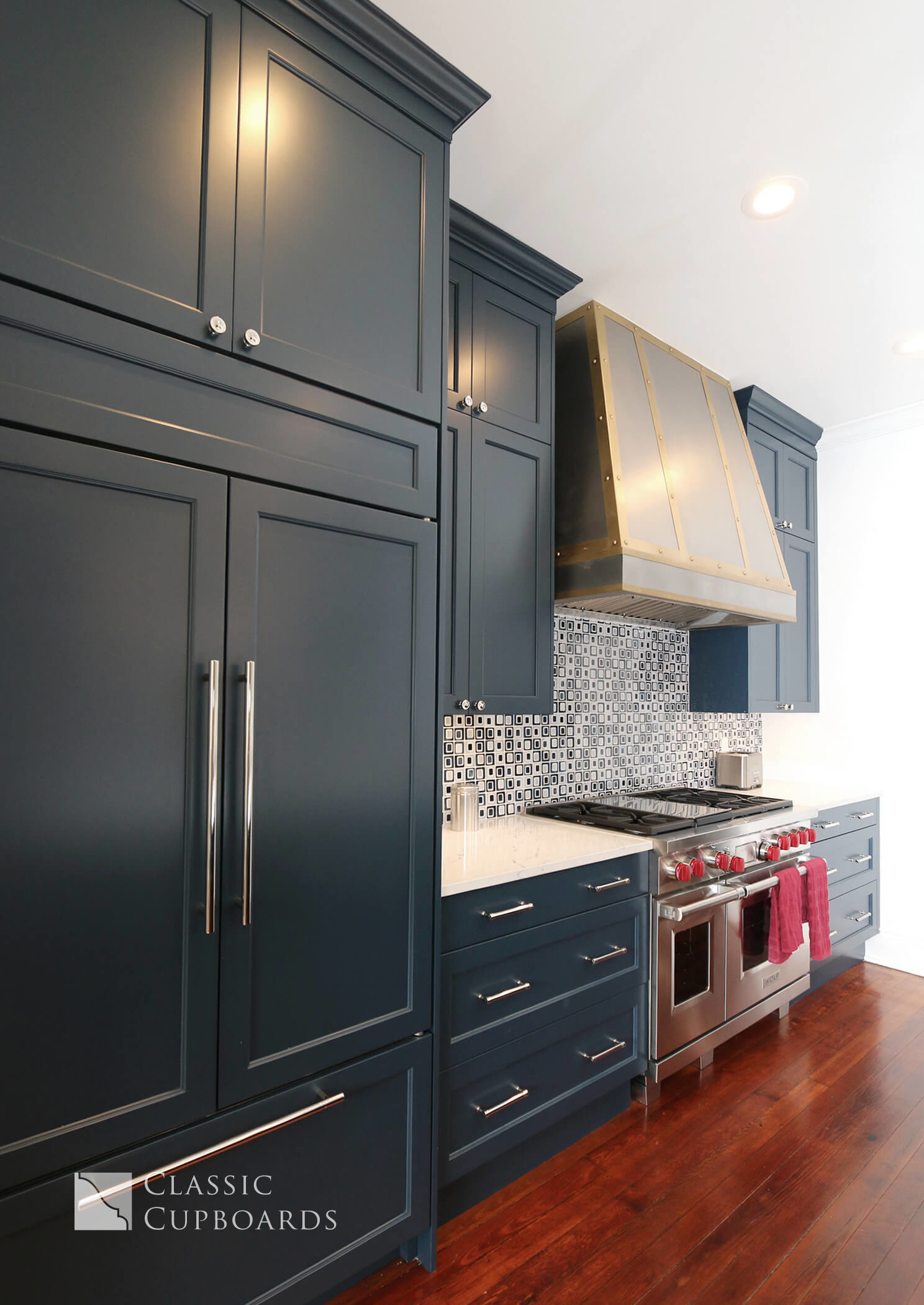 custom blue cabinets with built in fridge
