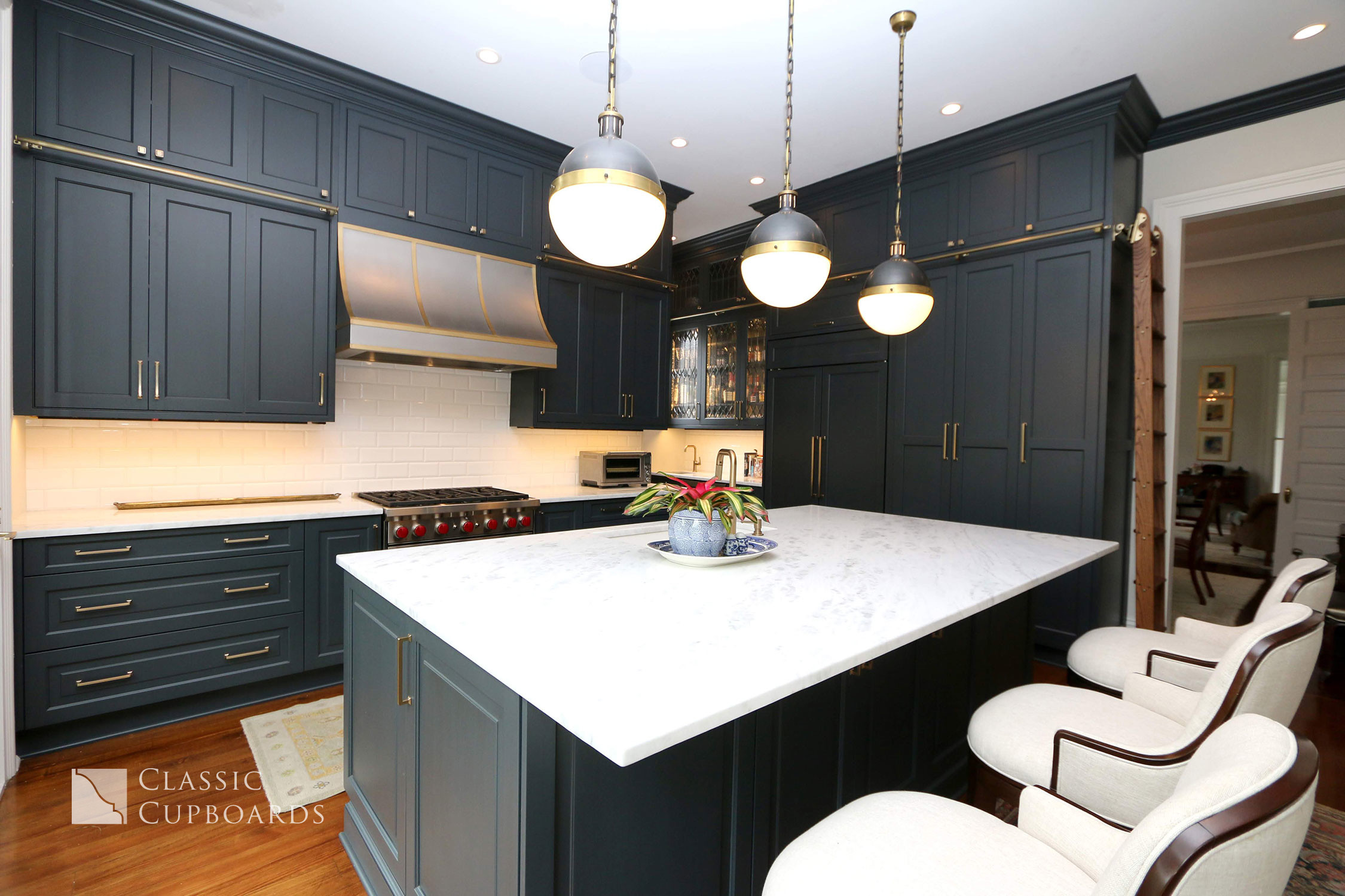 Traditional style kitchen with navy cabinets