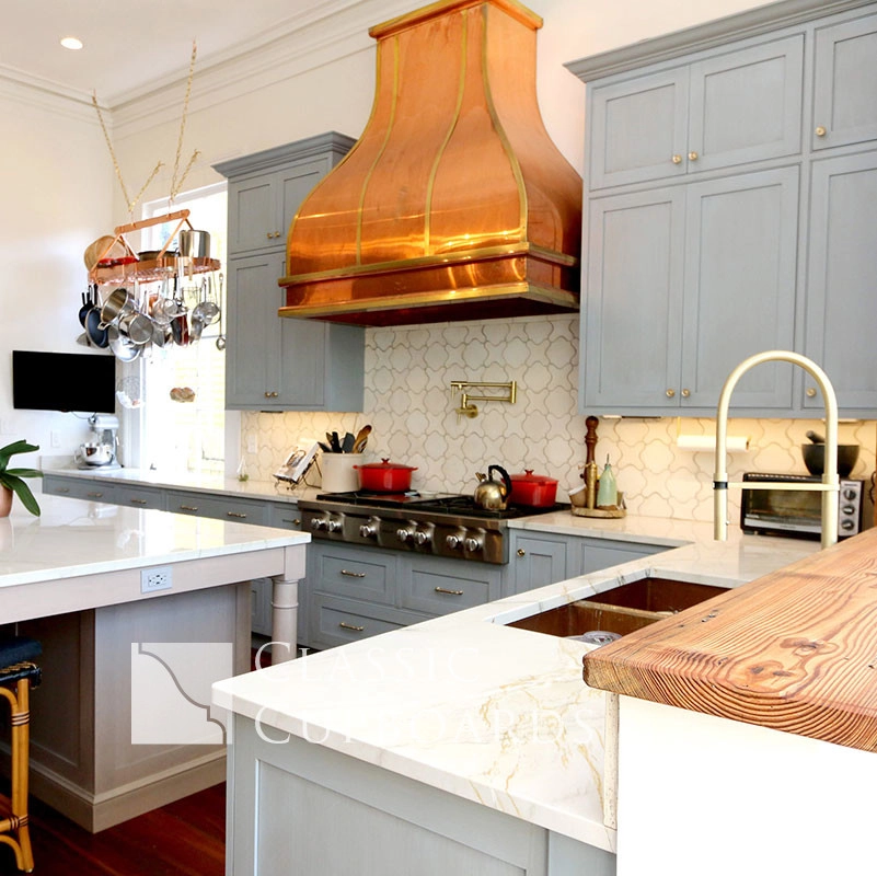kitchen with copper stove hood