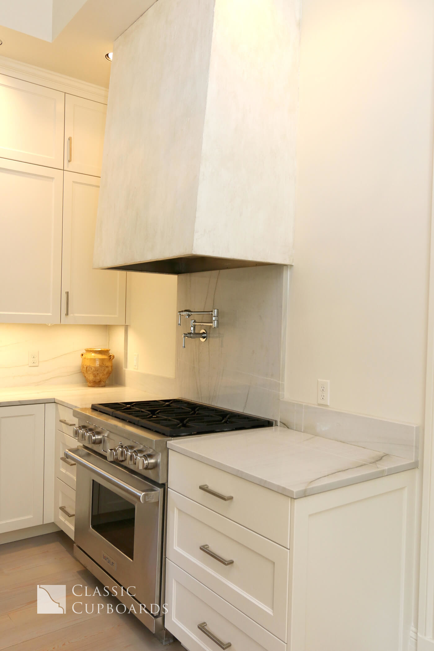 Transitional Kitchen with custom hood